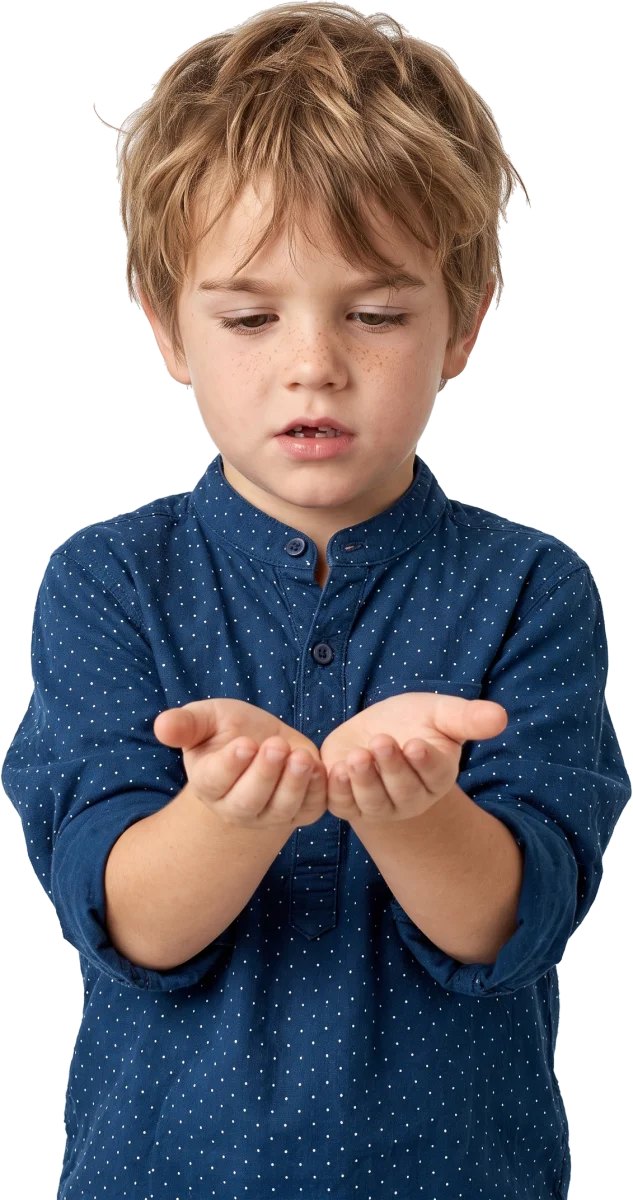 A boy of about five looking down into his cupped hands.