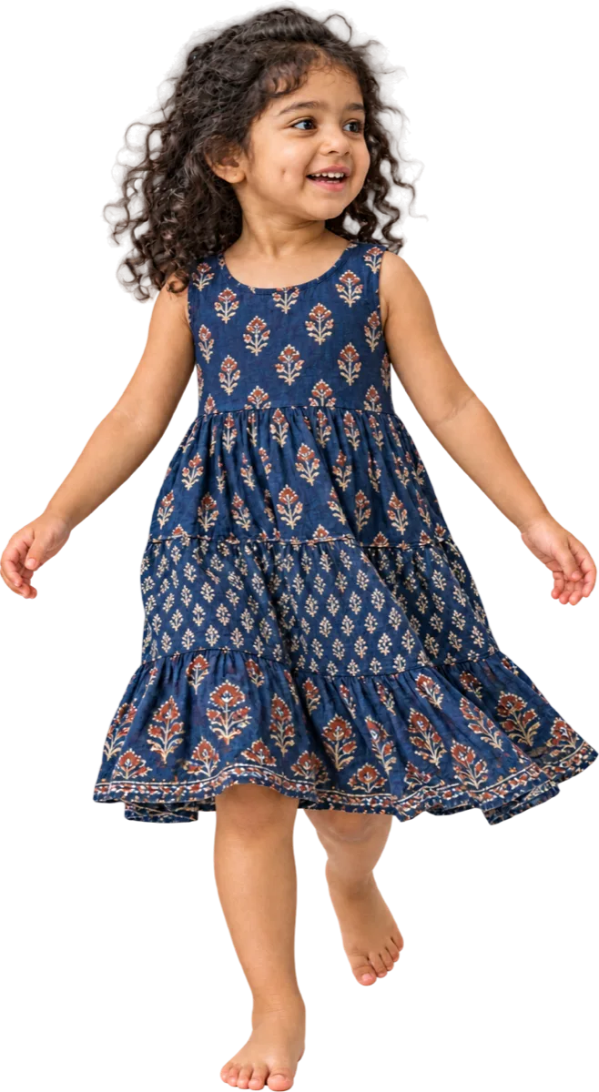 A girl of about four caught mid-step, arms slightly out for balance.